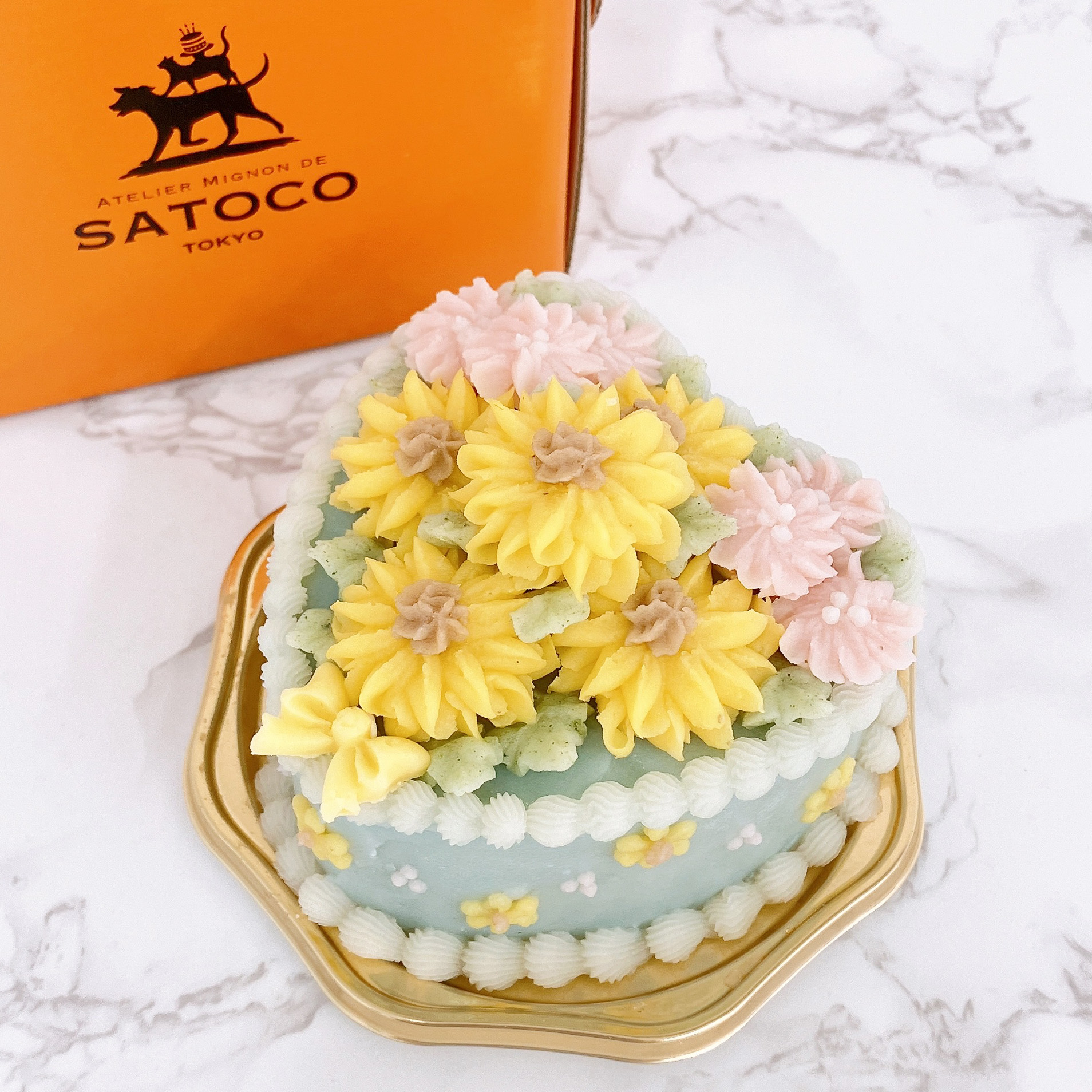 パステルカラーのひまわりのケーキ＞<br